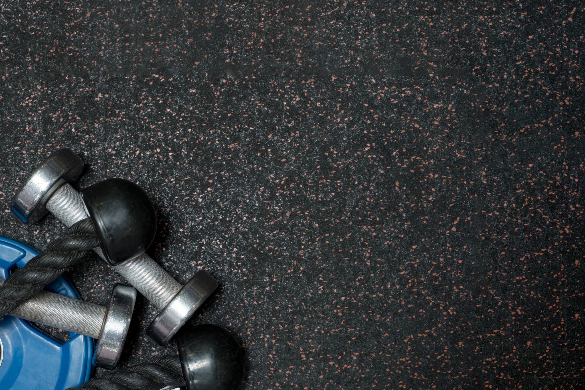 gym Equipment on floor in Gym.